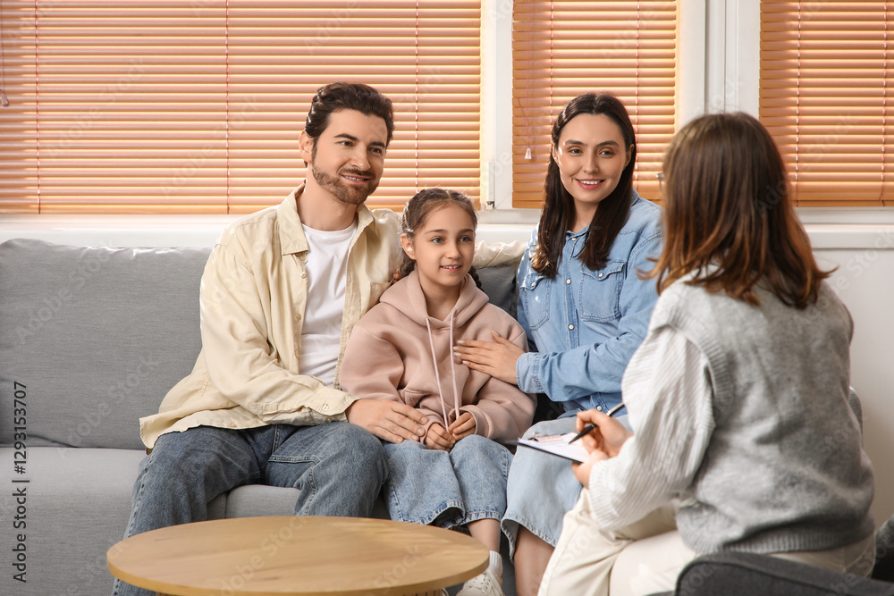 Happy couple adopting girl with social worker in office Happy couple adopting girl with social worker in office