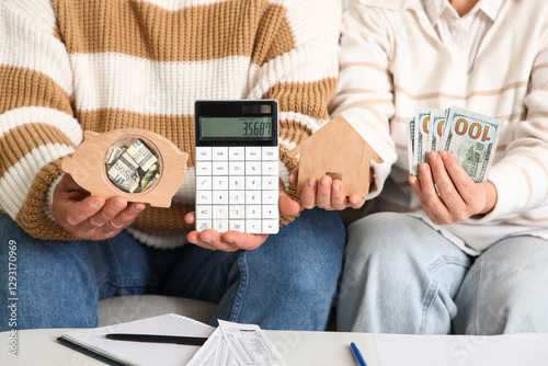 Senior couple holding money...