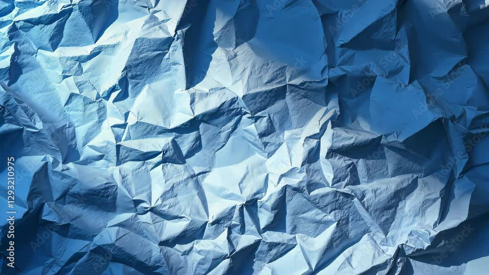 Crushed Paper Texture: A close-up view of a crumpled paper texture, capturing a myriad of shadows, light reflections, and abstract shapes.