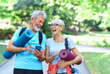 woman man senior couple active fitness elderly phone mobile smartphone happy together communication active outdoor healthy vitality exercise mat class training