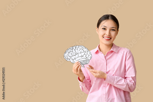 Young Asian woman with pape...