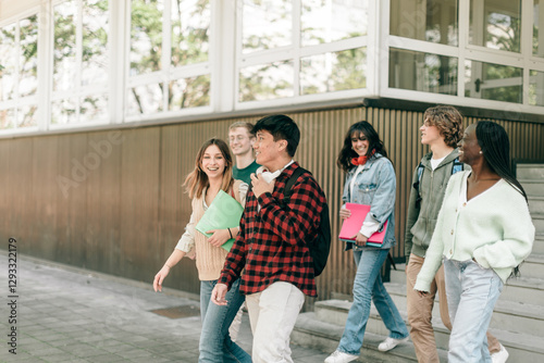 Happy diverse students walking outside school