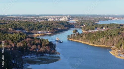 Wallpaper Mural General cargo ship navigating through narrow archipelago fairway. Vessel passing near shoreline. Aerial front view. Torontodigital.ca