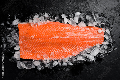 Fresh salmon fillet on ice. photo