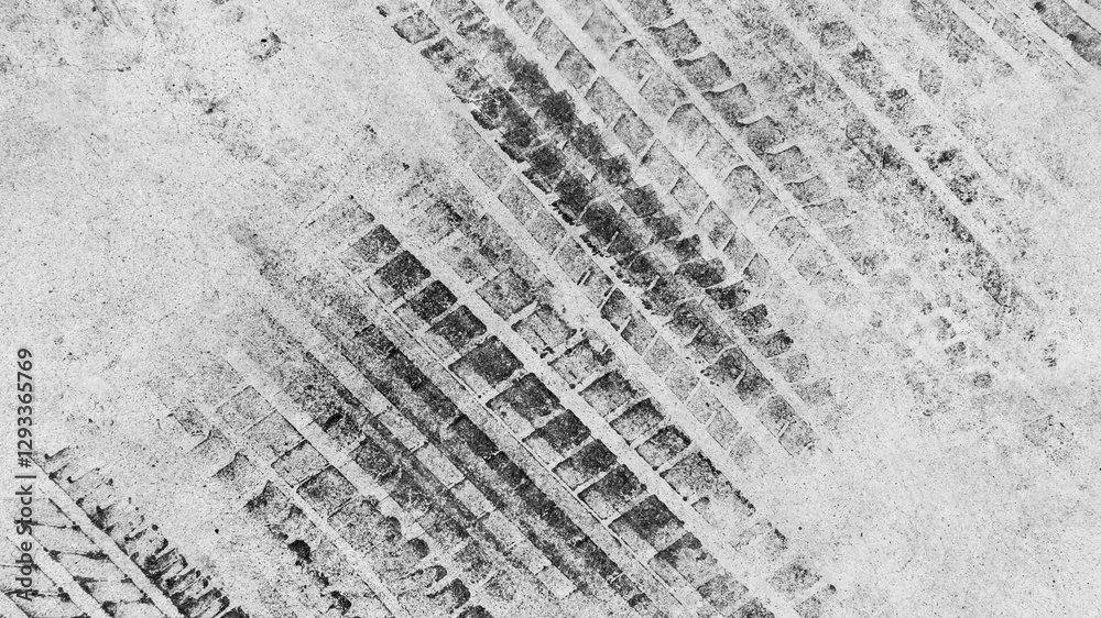 Black tire marks on road, Black rubber tire marks and tread marks, Tire trace track wheels texture and background, Auto tire tread grunge, Car wheel tyre tread track black tyre print, Top view.