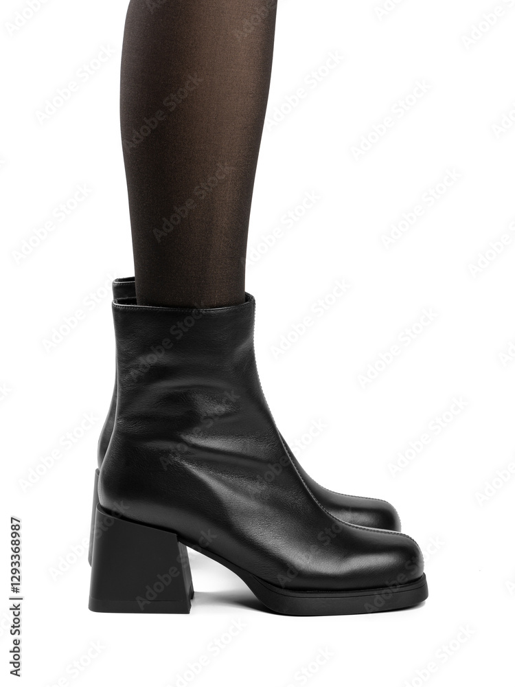 Women's shoes on a white background. Close up of a women's black leather chelsea boots on white background. Footwear for city, urban lifestyle or traveling. Concept of fashion, design and footwear. Women's shoes on a white background. Close up of a women's black leather chelsea boots on white background. Footwear for city, urban lifestyle or traveling. Concept of fashion, design and footwear.