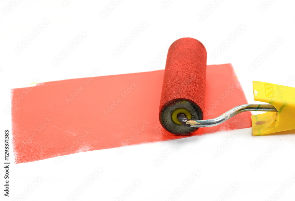 Obraz premium Painting a rough wall with roller. Paint roller leaving stroke of red color over a white background. usable for text and messages.