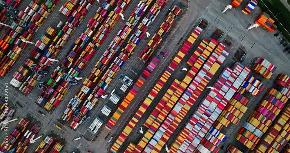 Aerial view of a container terminal with colorful cargo boxes neatly stacked