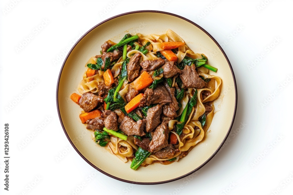Overhead shot of a plate of Pad See Ew, a popular Thai stir fried noodle dish with beef, carrots, and Chinese broccoli. Overhead shot of a plate of Pad See Ew, a popular Thai stir fried noodle dish with beef, carrots, and Chinese broccoli.