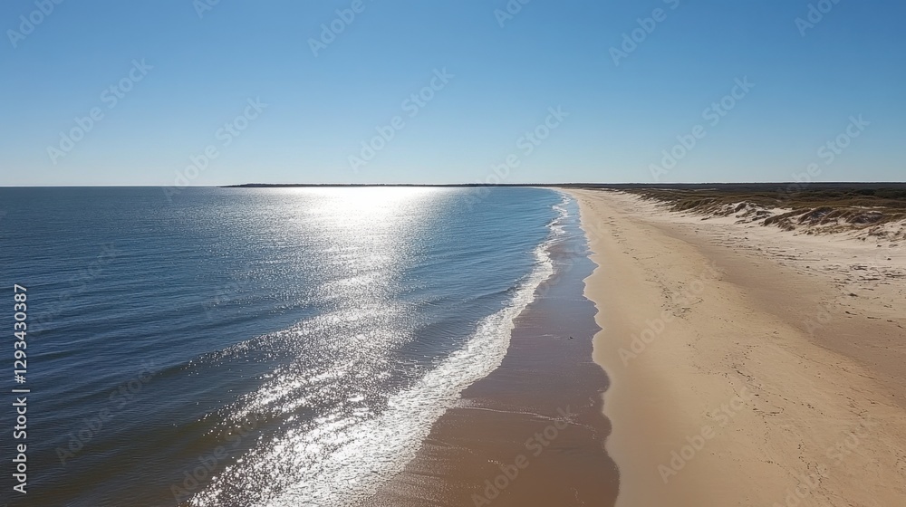 Shimmering ocean with tiny ripples forming gentle patterns near the shore Shimmering ocean with tiny ripples forming gentle patterns near the shore