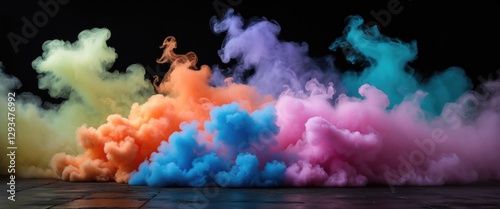 Vibrant colorful smoke diffusion on a dark background creating an artistic and dramatic visual effect for creative projects and designs.