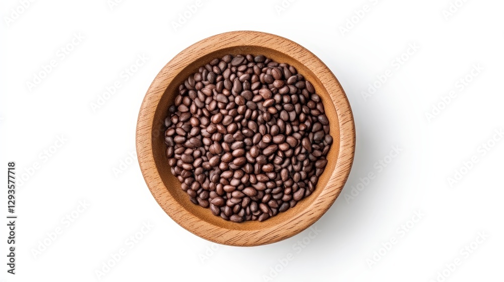 Dark brown grains in a rustic wooden bowl for culinary or decorative uses Dark brown grains in a rustic wooden bowl for culinary or decorative uses