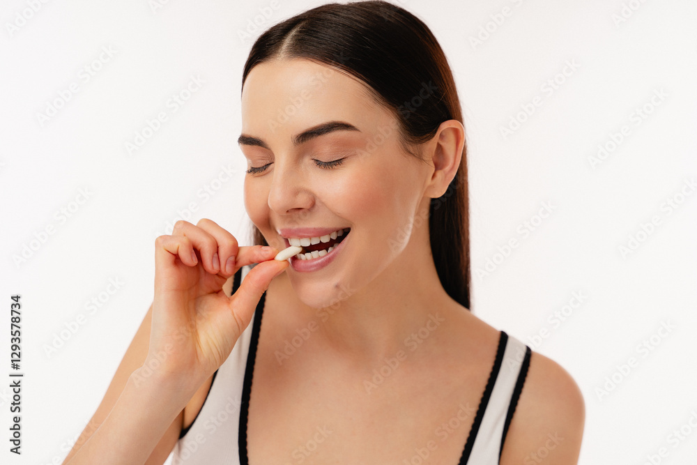 Smiling individual about to eat a small snack, promoting health and a balanced diet. Scene emphasizes emphasis on wellness, self-care, and a positive lifestyle in an inviting and friendly atmosphere. Smiling individual about to eat a small snack, promoting health and a balanced diet. Scene emphasizes emphasis on wellness, self-care, and a positive lifestyle in an inviting and friendly atmosphere.