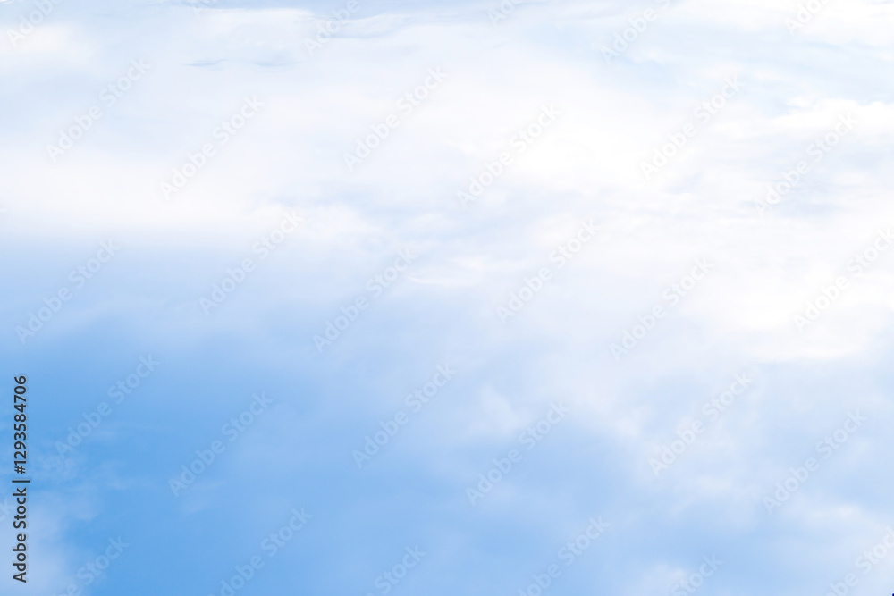 Obraz premium Expansive blue sky adorned with soft, fluffy clouds on a tranquil day