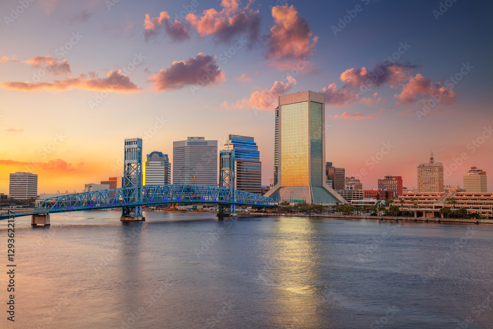 Jacksonville, Florida, USA. Cityscape image of Jacksonville, Florida with reflection of the city skyline in the water at beautiful sunset.