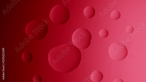A large drop connects with a small one on a red gradient background