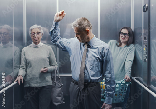 Man with sweaty armpits in a crowded elevator