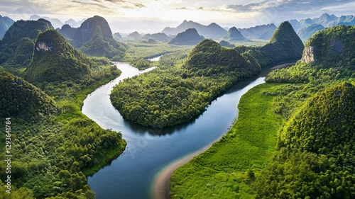 Serene River Valley: An aerial vista showcasing a meandering river winding through a lush valley, enveloped by majestic mountains, and vibrant greenery.