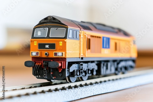 A model train sits on a miniature train track, great for illustrations or designs