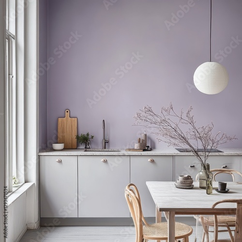 A kitchen features a modern design with subtle lavender walls