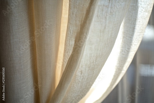 A close-up shot of a curtain with sunlight streaming through, creating a warm and inviting atmosphere