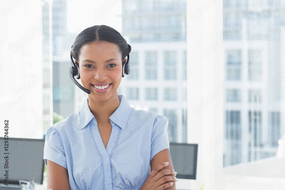 Wearing headset, businesswoman working in modern office, smiling while talking Wearing headset, businesswoman working in modern office, smiling while talking