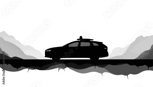 Silhouette of a car against a mountainous background