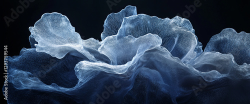 Close-up view of translucent, ice-like petals or fabric with intricate details and smooth texture, symbolizing delicacy, coldness, and elegance. photo