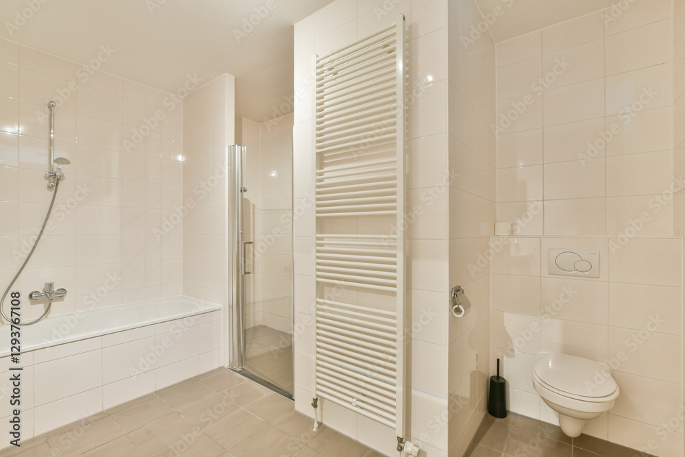 Obraz premium A sleek and contemporary bathroom featuring a shower cubicle, bathtub, and modern fixtures. The neutral palette enhances the clean lines of the space.