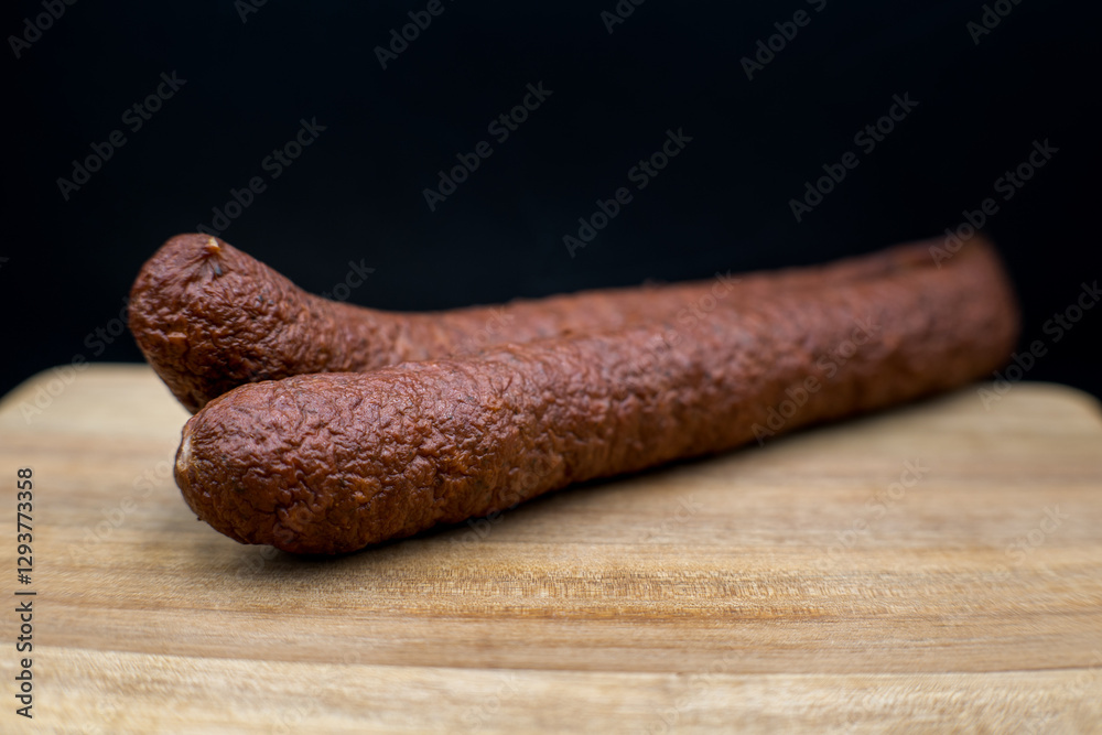 Dry smoked sausage, medium minced. Traditional taste and appetizing aroma.