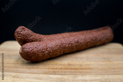 Obraz na płótnie Dry smoked sausage, medium minced. Traditional taste and appetizing aroma.
w salonie