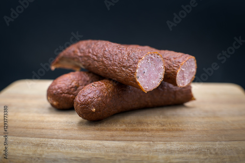 Obraz na płótnie Dry smoked sausage, medium minced. Traditional taste and appetizing aroma.
w salonie