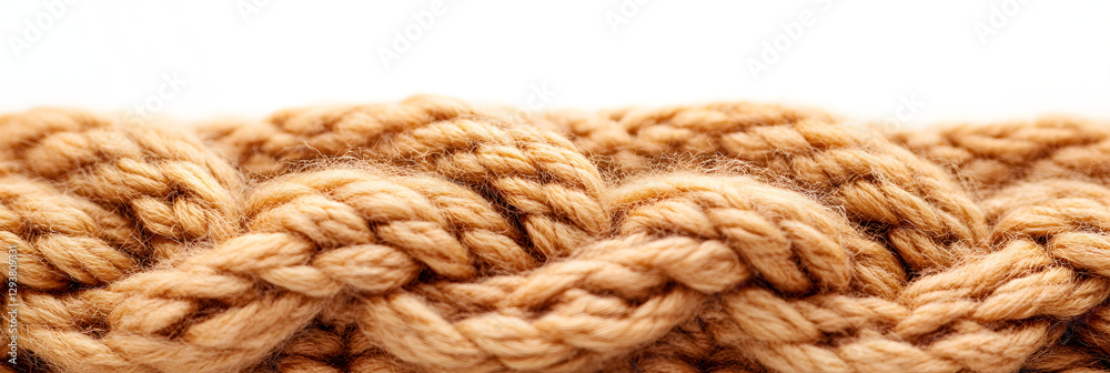 Close-Up of a Braided Knitted Wool Pattern in Warm Beige Tones - wide banner, white background Close-Up of a Braided Knitted Wool Pattern in Warm Beige Tones - wide banner, white background