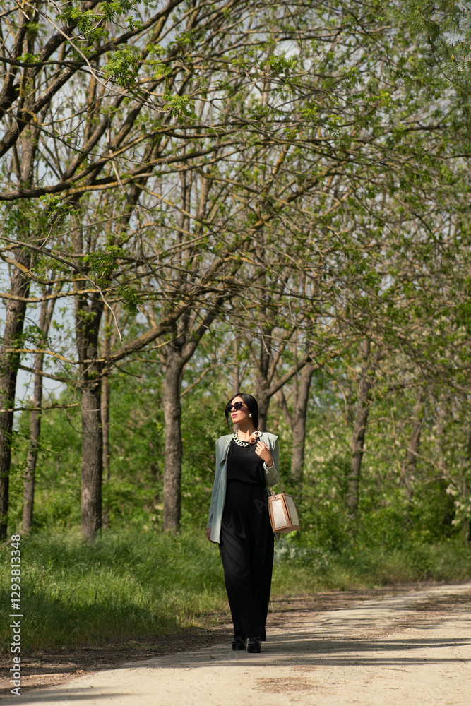elegant beautiful woman walking in the park elegant beautiful woman walking in the park