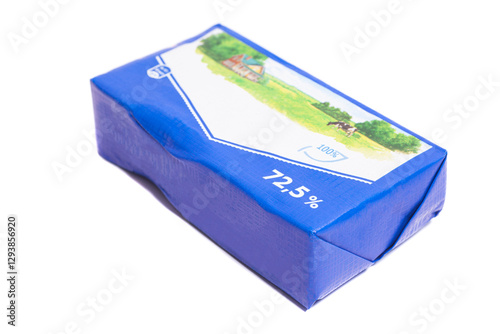 Stick of wrapped butter isolated on white background.