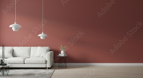 A minimalist living room features a white sofa, two pendant lights, a side table with a vase, and a terracottacolored wall. Light wood floors and a neutral rug complete the scene. photo