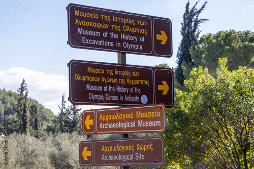 Fototapeta Naklejka Na Ścianę i Meble -  A street sign to direct people toward the Olympia Archaeological Site and Museum. 