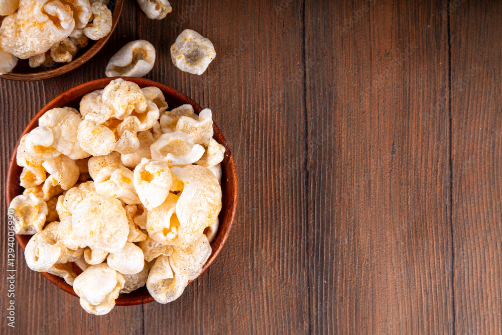 Cracklings or skwarki, fragrant crispy snack made from fried skin of the pork with spices. British, Scottish, Eastern European traditional salted scratchings Cracklings or skwarki, fragrant crispy snack made from fried skin of the pork with spices. British, Scottish, Eastern European traditional salted scratchings