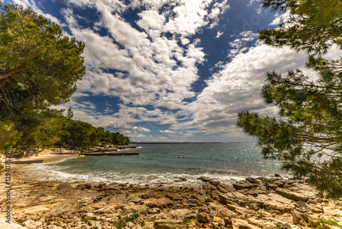 Fototapeta Naklejka Na Ścianę i Meble -  Wild beaches without people, a moment before the storm and storm on the Adriatic Sea, around Rovinj, Istrian heavy sky with clouds, rough waves, wild nature
