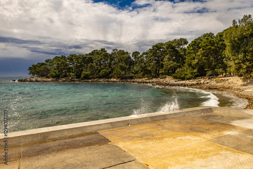 Fototapeta Naklejka Na Ścianę i Meble -  Wild beaches without people, a moment before the storm and storm on the Adriatic Sea, around Rovinj, Istrian heavy sky with clouds, rough waves, wild nature