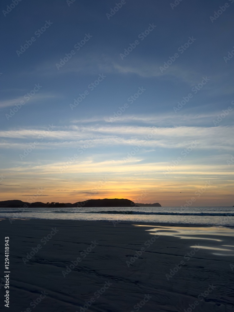 Tranquil sunset over the ocean horizon Tranquil sunset over the ocean horizon