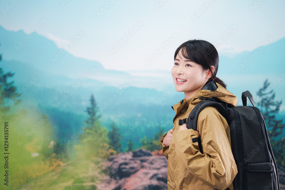 Naklejka premium 山登りを楽しむ若い女性