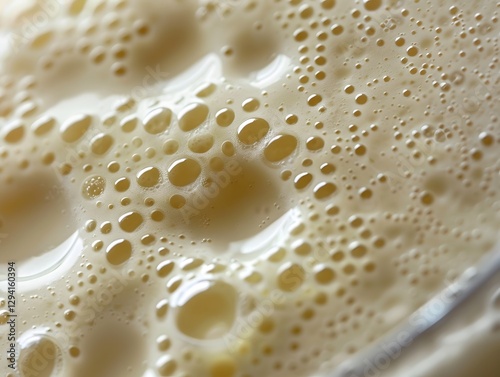 Detailed Close-up Macro of Creamy Vanilla Protein Shake with Condensation Droplets and Air Pockets on Surface