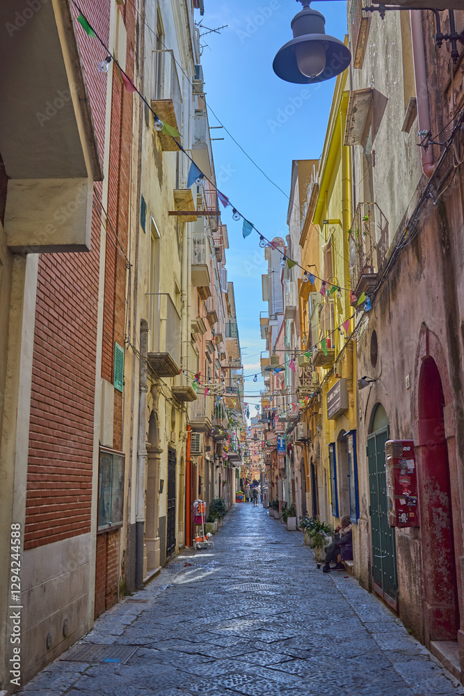 Obraz premium Narrow Cobblestone Street in Historic Town