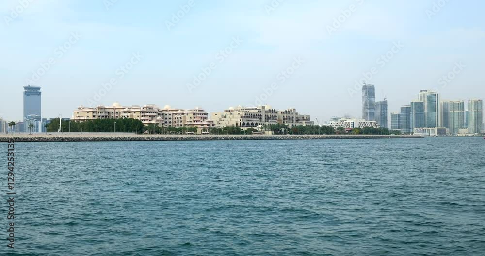Waterfront view of luxury resorts and skyscrapers in Dubai Waterfront view of luxury resorts and skyscrapers in Dubai