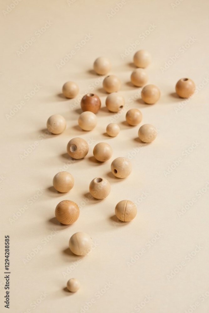 Scattered Wooden Beads on a Neutral Background A Simple, Elegant Arrangement for Craft Projects and Design Inspiration Scattered Wooden Beads on a Neutral Background A Simple, Elegant Arrangement for Craft Projects and Design Inspiration