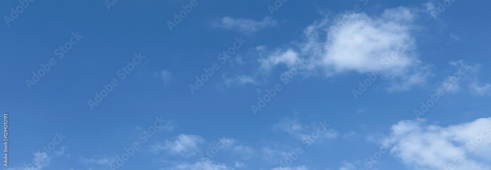 Daytime sky with fluffy clouds and clear blue backdrop. Premium beautiful cloud photography with perfect height, Background for banners, and website posters. Daytime sky with fluffy clouds and clear blue backdrop. Premium beautiful cloud photography with perfect height, Background for banners, and website posters.