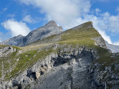 Alpine peaks Chli Hohmad (2492 m) and Gross Hohmad (2307 m) above the Tannensee lake (or Tannen lake) and in the Uri Alps mountain massif, Melchtal - Canton of Obwalden, Switzerland (Schweiz) photo