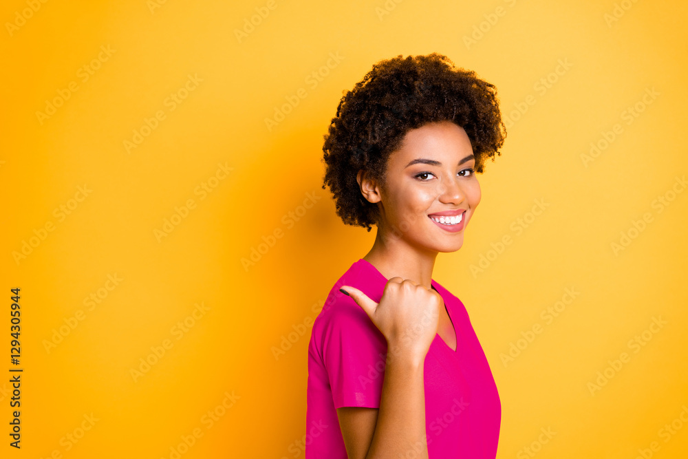 Copyspace photo of cheerful charming cute attractive youngster pointing at sales started at shopping mall with her thumb isolated over vivid color background Copyspace photo of cheerful charming cute attractive youngster pointing at sales started at shopping mall with her thumb isolated over vivid color background