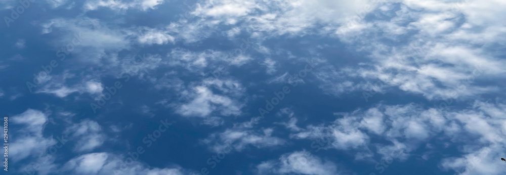 Puffy clouds create a casual pattern in the sky. Modern beautiful and charming blue sky and cloud photo. Premium background design for website. Puffy clouds create a casual pattern in the sky. Modern beautiful and charming blue sky and cloud photo. Premium background design for website.